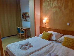 Postel nebo postele na pokoji v ubytování Hotel Gold
