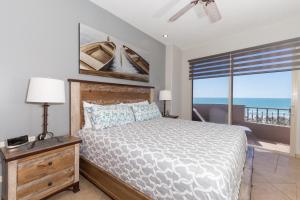 a bedroom with a bed and a view of the ocean at Bella Sirena 502-A Beachfront Luxury - Best Views, Best Location in Puerto Peñasco +103 photos