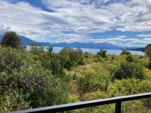 a view of a body of water from a balcony at Refugio Huerta Los Maquis in Puerto Guadal