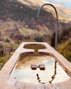 a pool of water with a street light at Boutique Chalet Panoramic Views Hot Tub in Vers L'Eglise