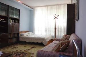 a living room with a couch and a window at Apartment Dora in Pomorie