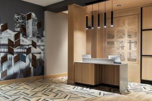 a lobby of a hotel with a reception desk at Hyatt Place Columbus Polaris in Columbus