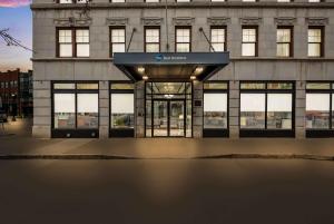 a building with an open door in front of it at Best Western Syracuse Downtown Hotel and Suites in Syracuse