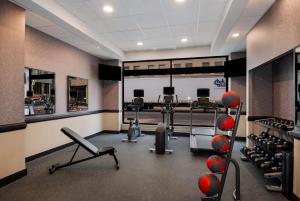 a gym with treadmills and exercise equipment in it at Best Western Syracuse Downtown Hotel and Suites in Syracuse