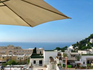 a view of a city from under an umbrella at Borgo Antico di Capri in Capri