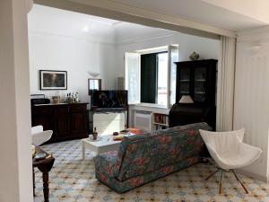 a living room with a couch and a table at Borgo Antico di Capri in Capri