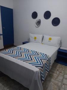 Voodi või voodid majutusasutuse HOTEL INTI toas