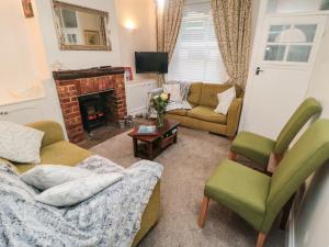 Et opholdsområde på Saints Cottage