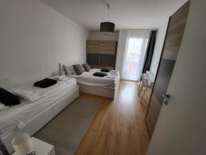 Posteľ alebo postele v izbe v ubytovaní SDP Futo Apartment
