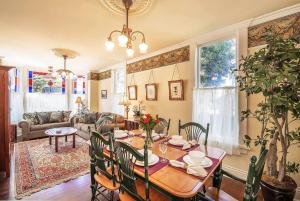a dining room with a table and chairs and a living room at 3812 Little House home in Pacific Grove