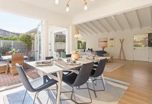 a white dining room with a table and chairs at 3867 Dolce Tempo home in Carmel