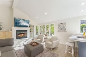 a living room with a couch and a fireplace at 3867 Dolce Tempo home in Carmel