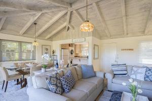 a living room with a couch and a table at 3786 Adobe by the Sea home in Pebble Beach