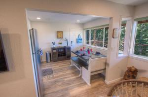 a kitchen with a desk and a refrigerator in it at Awesome Dawson condo in Stateline