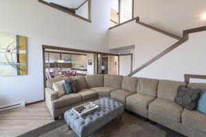 a living room with a couch and a table at 3823 Sand Dollar House condo in Castroville