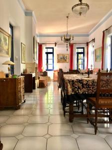 a dining room with a table and chairs at Traditional House at Aegina Port in Aegina Town