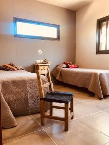 Ένα ή περισσότερα κρεβάτια σε δωμάτιο στο La Pasionaria Casa de Campo