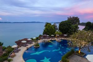 an overhead view of a swimming pool at a resort at Supalai Scenic Bay Resort And Spa, SHA Extra Plus in Por Bay