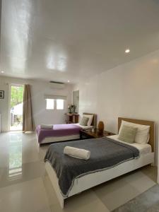 Postel nebo postele na pokoji v ubytování Everrich Boutique Resort Boracay