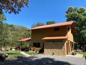 a large house with a large yard in front of it at Caldera River Canyon in Caldera
