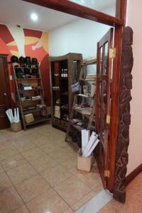 a room with a door open to a room with shoes at Sunset INN by Pro-Ema in Dili