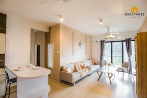 a living room with a couch and a table at INS Home at Midhills Genting Highlands Free WiFi in Bentong