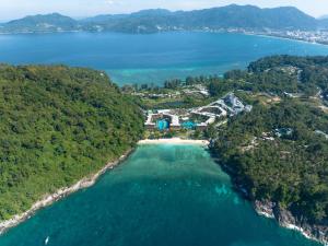 an aerial view of a resort on a island in the water at Phuket Marriott Resort & Spa, Merlin Beach in Patong Beach