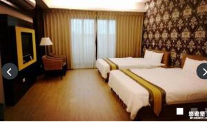 Ένα ή περισσότερα κρεβάτια σε δωμάτιο στο 墾丁幸福路上民宿