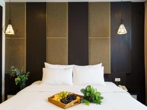 Voodi või voodid majutusasutuse Keypad Hotel - 24 Hang Ga toas
