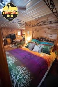 a bedroom with a large bed in a room at Climb On Inn Naturally Gorgeous Apt #2 Red River Gorge Kentucky 