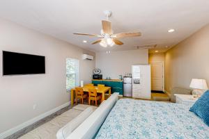 a living room with a couch and a table at Calm Waters - Carriage House in Santa Rosa Beach