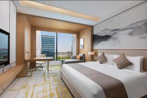 Postel nebo postele na pokoji v ubytování Metropark Hotel Hongqiao Shanghai