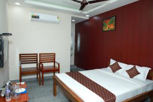 Postel nebo postele na pokoji v ubytování Redstone Hotel - Near US Consulate Nungambakkam