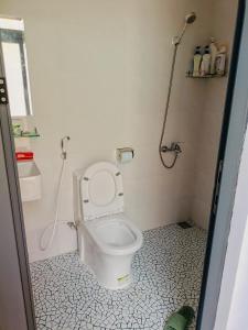 a bathroom with a toilet and a shower at Sohi Homestay in Quy Nhon