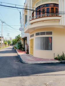 an empty street in front of a building at Sohi Homestay in Quy Nhon