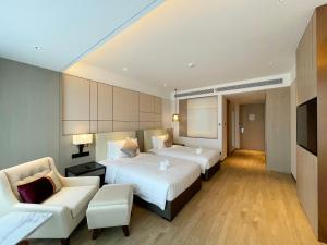 Postel nebo postele na pokoji v ubytování Kew Green Hotel Hongqiao Shanghai