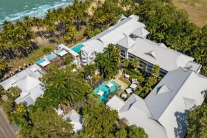 an aerial view of a house with the ocean at Belle Escapes Poolside Ground Floor Suite 41 Alamanda Palm Cove in Palm Cove