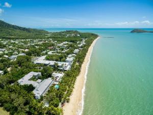 an aerial view of a beach with a resort at Belle Escapes 94 Cascade Luxury Home Palm Cove in Palm Cove