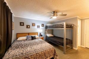 a bedroom with a bed and a bunk bed at ML204 2BR/2BA Bright & Airy Lift View WiFi EZ Park in Dunmore