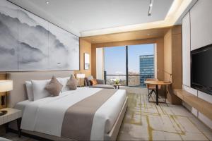 Postel nebo postele na pokoji v ubytování Metropark Hotel Hongqiao Shanghai