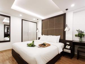 Voodi või voodid majutusasutuse Keypad Hotel - 24 Hang Ga toas