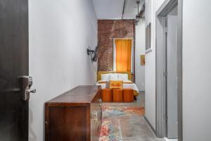 a hallway with a living room with a couch at The Davis Lofts at Main Street - Unit 1E in Rocky Mount