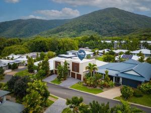 an aerial view of a resort with mountains in the background at Belle Escapes Havenly Luxury Villa Palm Cove in Palm Cove