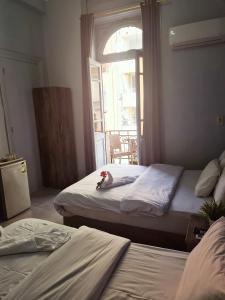 A bed or beds in a room at The Australian Hostel
