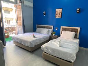 A bed or beds in a room at The Australian Hostel