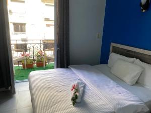 A bed or beds in a room at The Australian Hostel