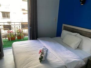 A bed or beds in a room at The Australian Hostel