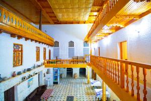 a large room with a staircase in a building at Zaringiz Boutique in Bukhara