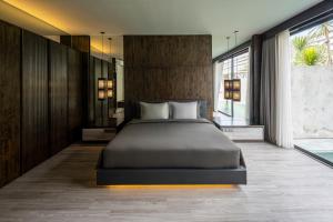 Un pat sau paturi într-o cameră la INSPIRA Seminyak