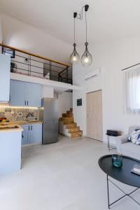 A kitchen or kitchenette at SaniStoneVillas